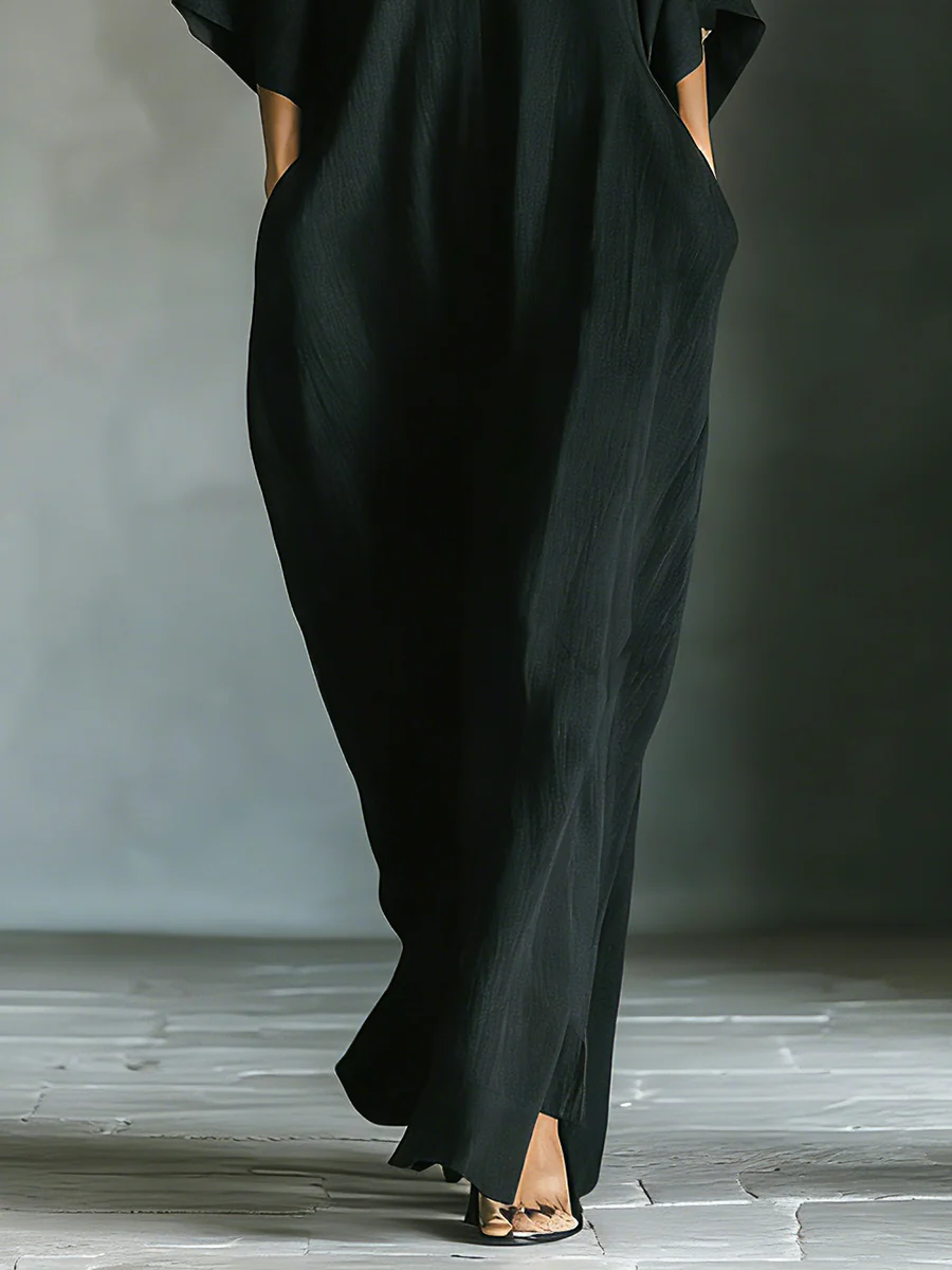Alessandra • Vestido largo negro oversize minimalista con mangas kimono